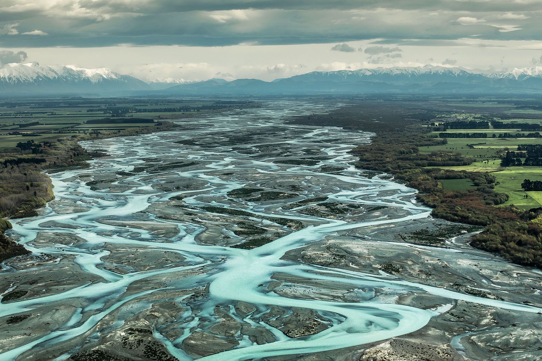 Braided river channels converging into clarity